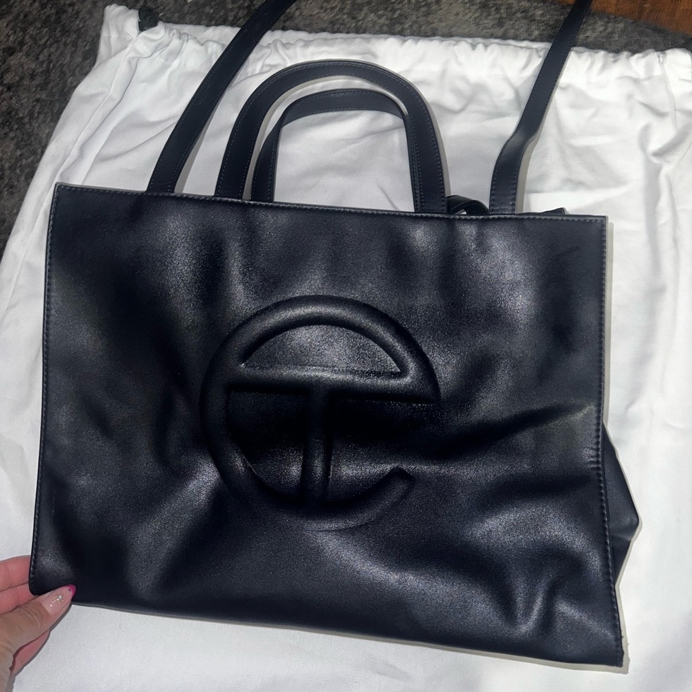 Used navy blue telfar